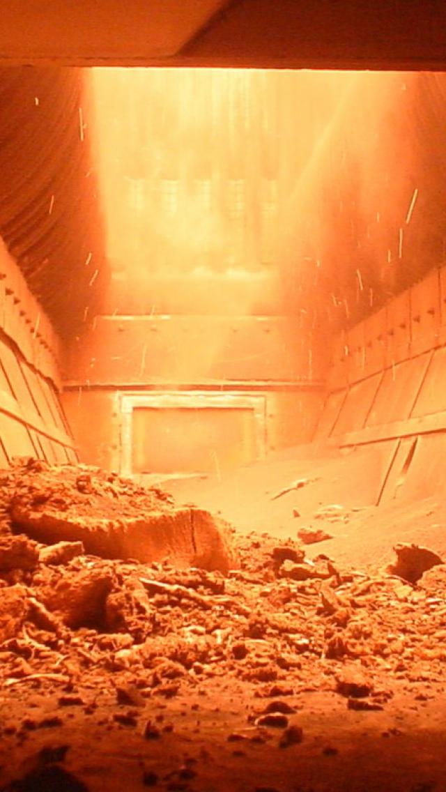 Dry bottom ash handling system for high-ash content coals